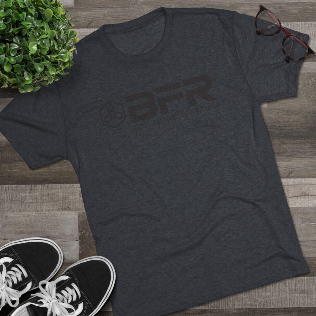 Gray BFR t-shirt on wooden surface.