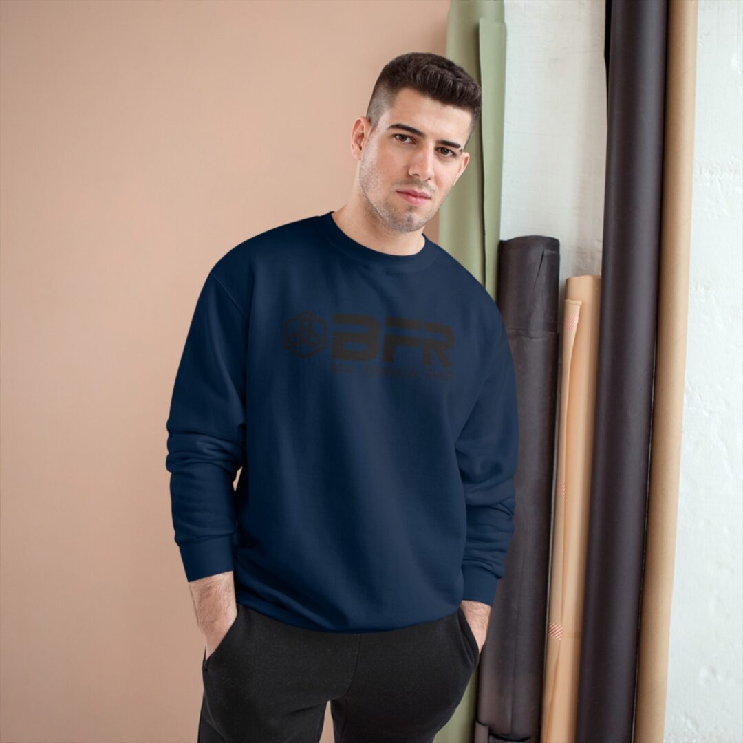 Man wearing a dark blue sweatshirt indoors. Man wearing a dark blue sweatshirt indoors.
