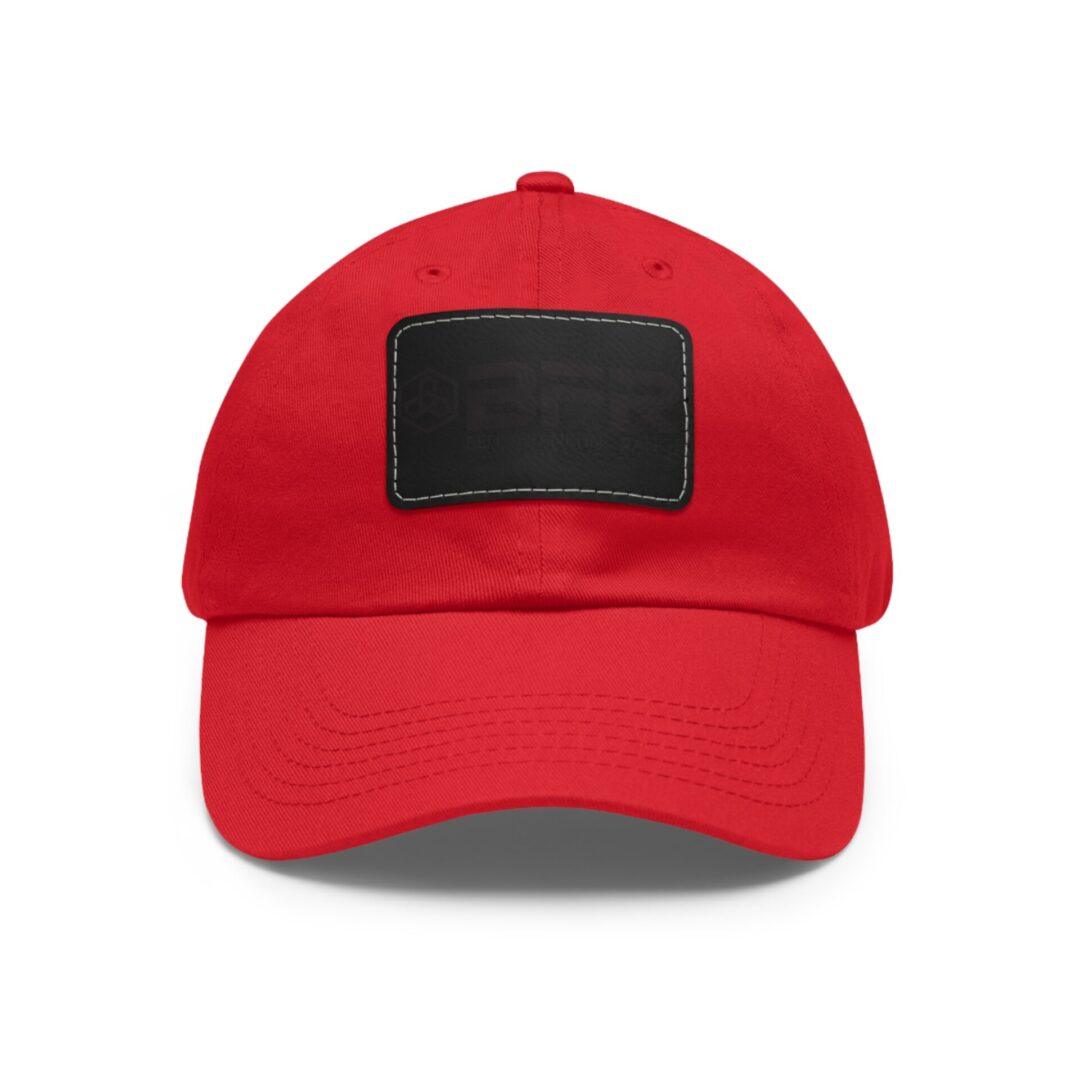 Red baseball cap with black patch.