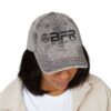 Woman wearing a cap with BFR logo.