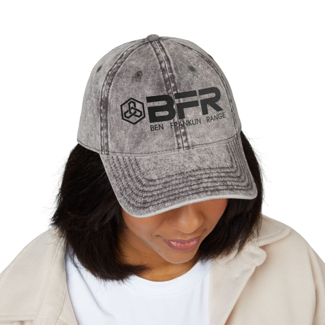 Woman wearing a cap with BFR logo.