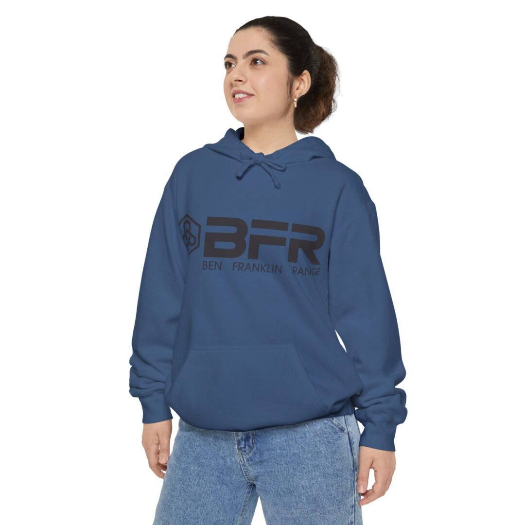 Woman wearing blue hoodie with BFR logo.