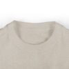 Beige T-shirt neckline close-up view.