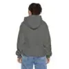 Person in hoodie and jeans, facing away.