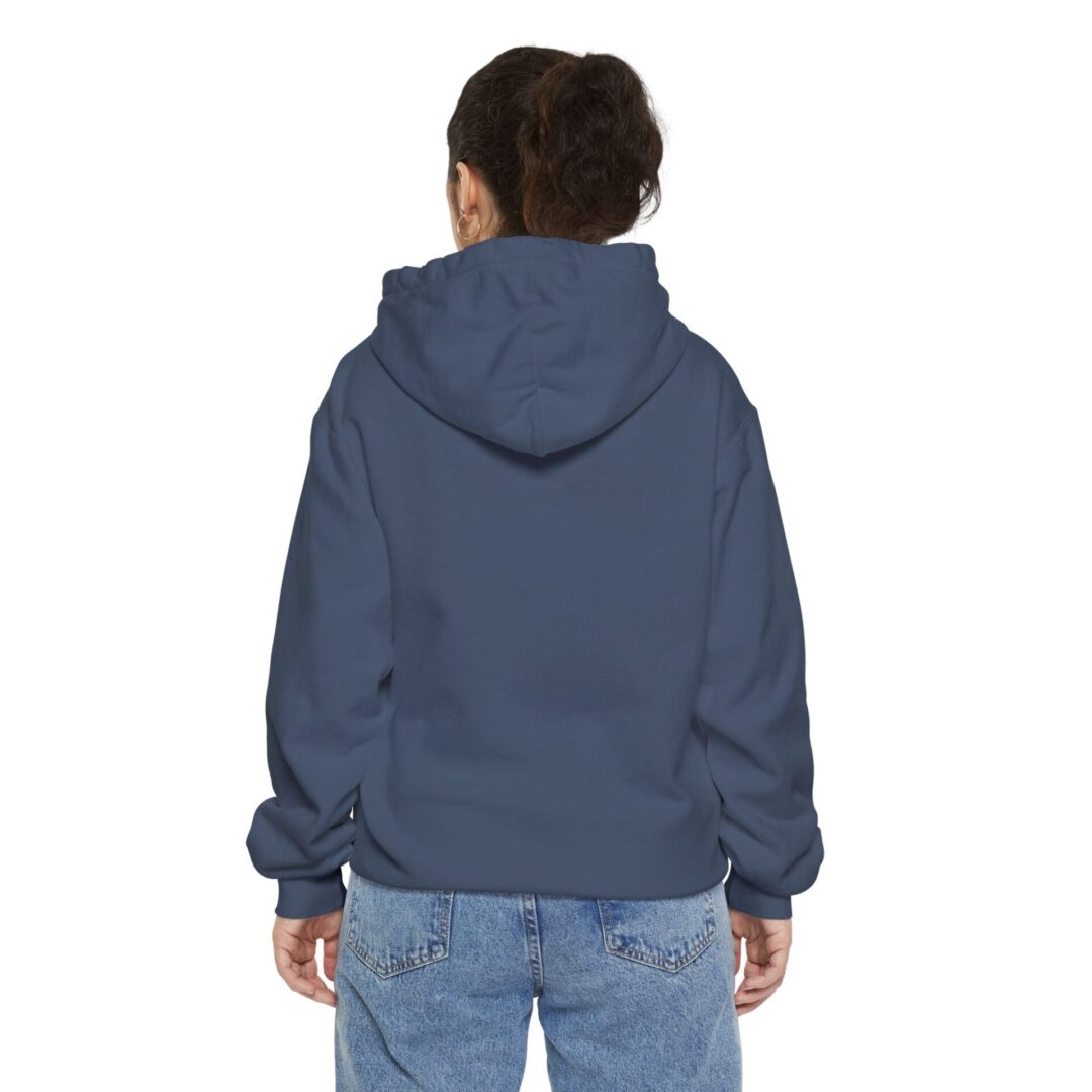 Child in blue hoodie and jeans, rear view.