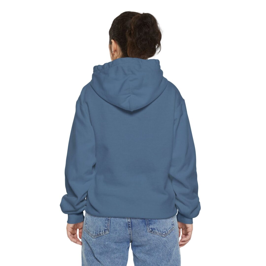 Person wearing blue hoodie and jeans, back view.