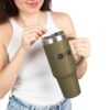 Woman holding a large green mug.